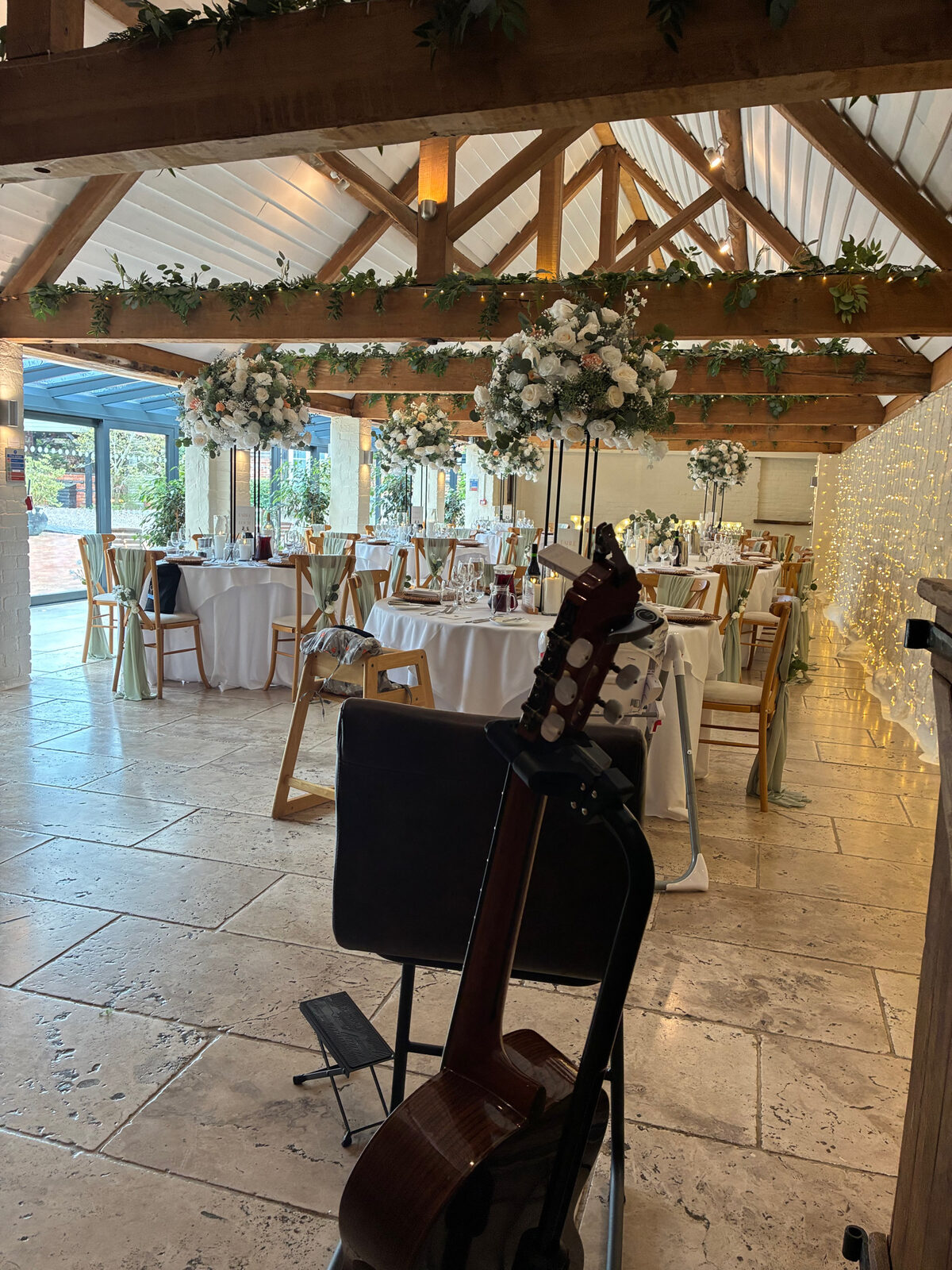 Guitar set up in the Curradine Barns dining room, ready for the wedding breakfast